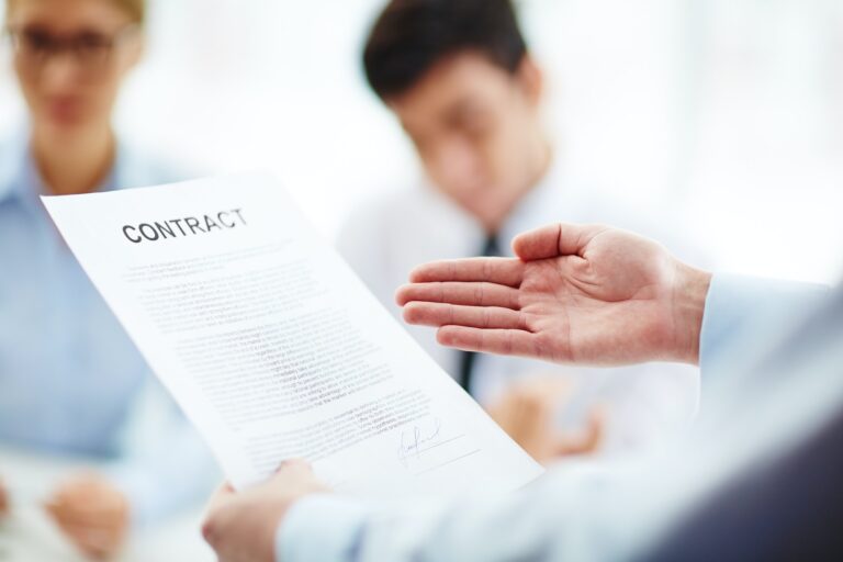 Business contract in hand
