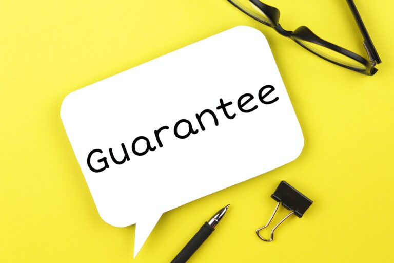 White paper speech bubble with inscription guarantee